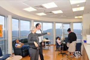 Dr. Ben Sedley, viewing the patient and family lounge overlooking the Jerusalem Hills in the Dyna and Fala Weinstock Department of Pediatric Hemato-Oncology.