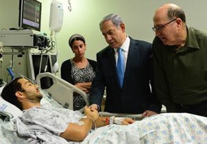 Prime Minister Benjamin Netanyahu and Defense Minister Moshe Yaalon  visit victim of terrist attack.  Photo by  Kobi Gideon, GPO  