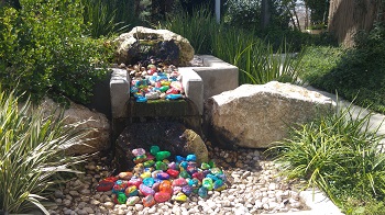 Peace stones in the fountain of the Healing Garden outside the Department for Children with Chronic Diseases